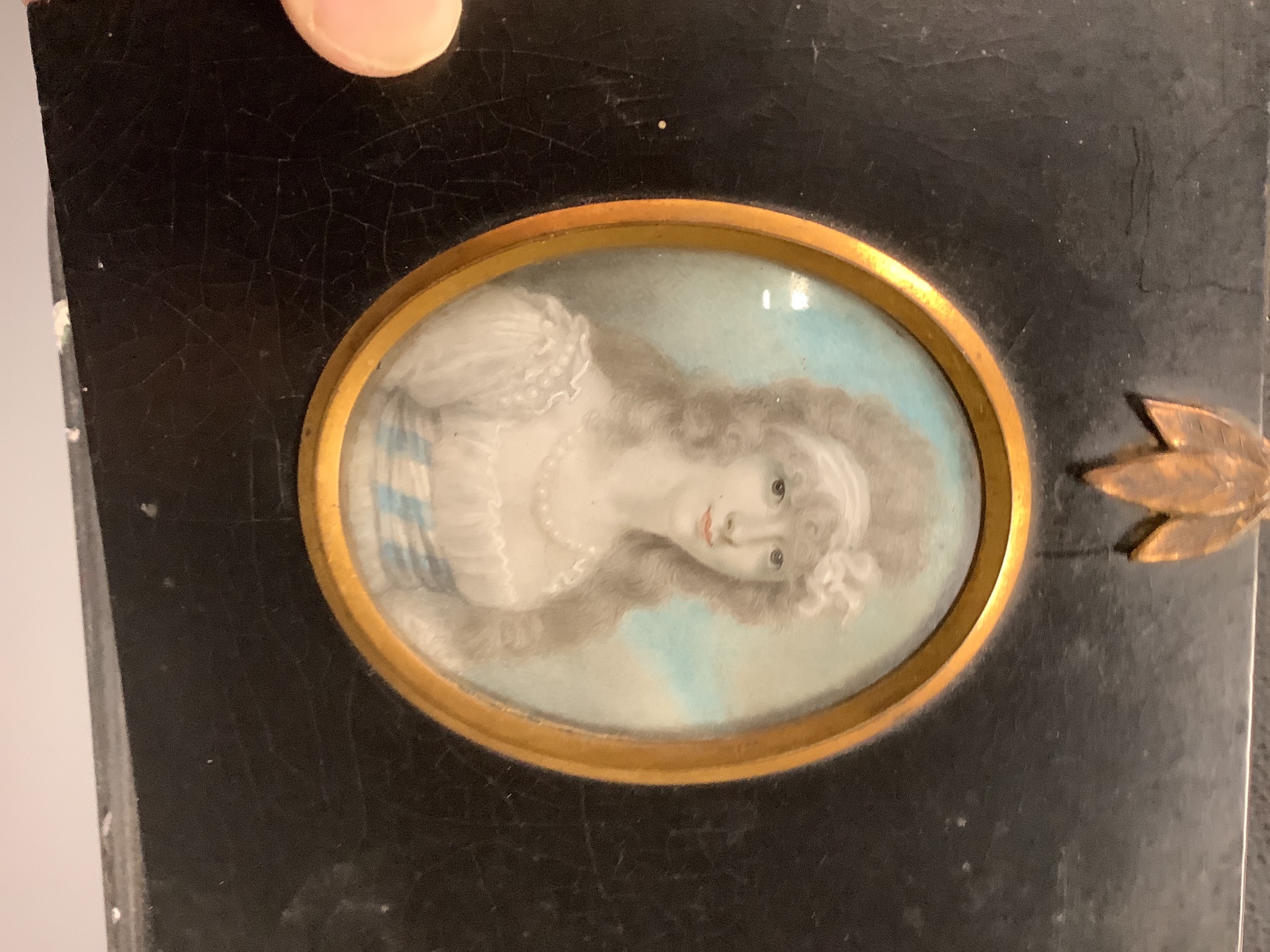 Attributed Richard Cosway R.A. (1742-1821); A portrait miniature on ivory of a lady, 7.7 cm x 6 and a pair of early 19th century portrait miniatures on Ivory of a gentleman and lady